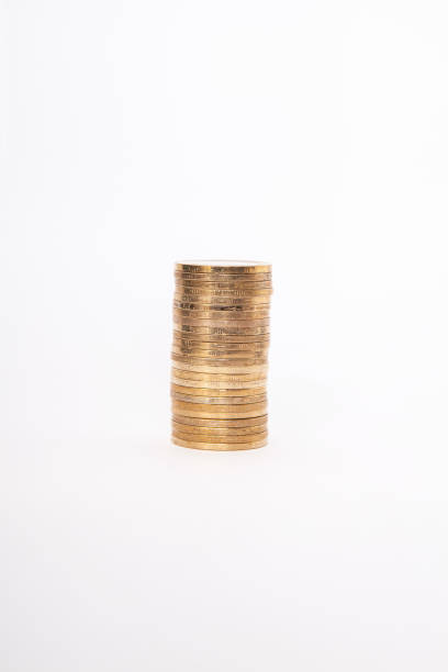 istock Close-up of coins stack on white background. Saving money concept. 2203087145