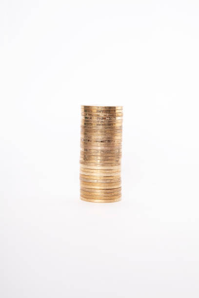 istock Close-up of coins stack on white background. Saving money concept. 2203087153