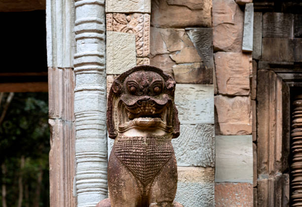Shot in color detail on the facade of this historic building representing some character, animal or flower. Set at Siem Reap, Angkor Wat , Cambodia, Asia