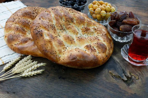 istock Pide - Turkish pita on rustic wood background 2203090426