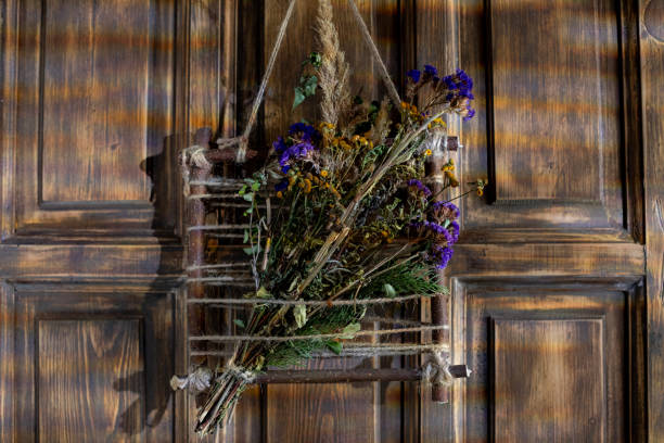 Wedding reception decoration with flower and greenery wreath on window