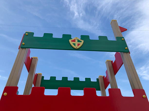 Fortress with tower against blue sky low angle view, children's playground