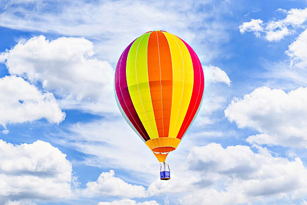 istock Hot air balloon flight over blue sky 2203095286