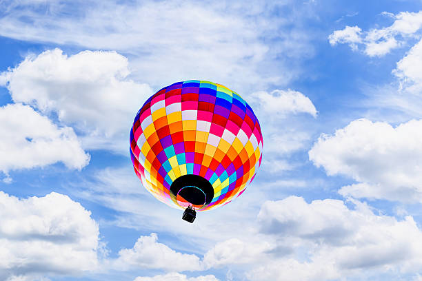 istock Hot air balloon flight over blue sky 2203095288