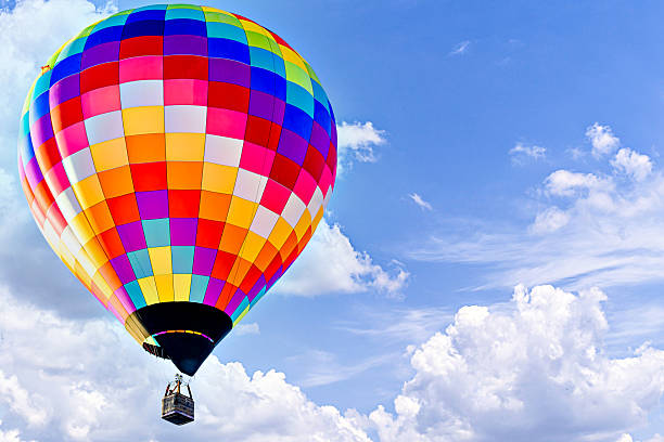 istock Hot air balloon flight over blue sky 2203095289