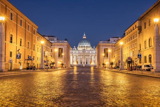 The dome of St. Peter dominates the city of Rome by night