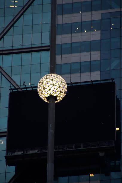 Iconic Times Square New Year's Eve Ball on a building facade in New York City, showcasing urban architecture and festive spirit.
