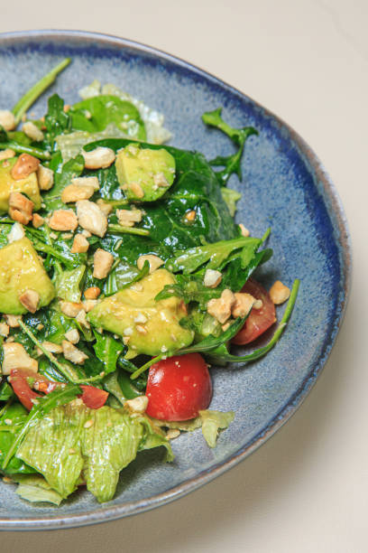 istock image shows a vibrant and healthy-looking salad in a blue ceramic bowl 2203100542
