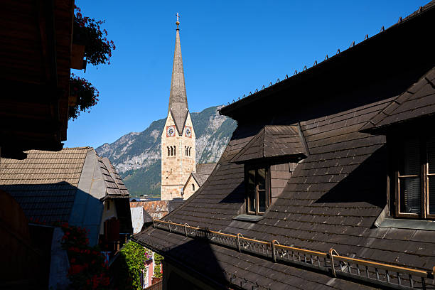 The Evangelical Church steeple over the rooftops in Salzkammergut, Hallstatt, Austria.