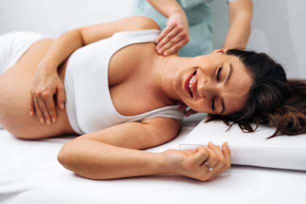 istock Pregnant woman at relaxing massage 2203106854