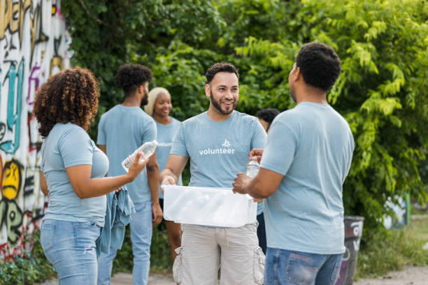 Diverse Group of Volunteers Distributing Water Bottles