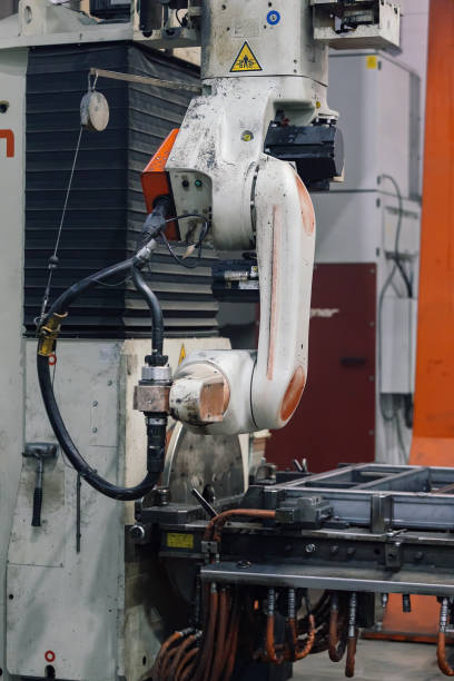 istock Industrial robot for welding metal parts 2203109035