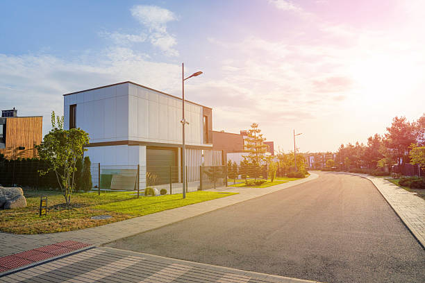 istock Modern Contemporary Home with lawn, shrubs, green courtyard. 2203110366