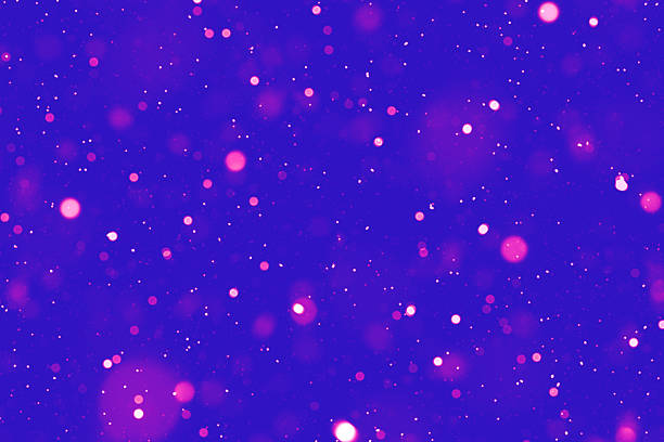 istock Bright bokeh lights on a vibrant purple background creating a festive atmosphere 2203111382