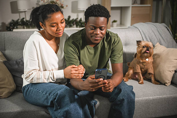 istock young couple on a date with smart phone 2203112595