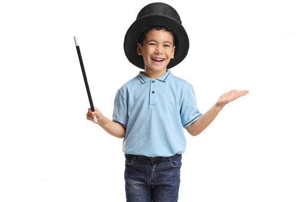 istock Boy wearing a magician top hat and holding a wand 2203118775