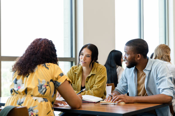 istock Diverse Group of Students Studying Together in a Bright Classroom 2203120195