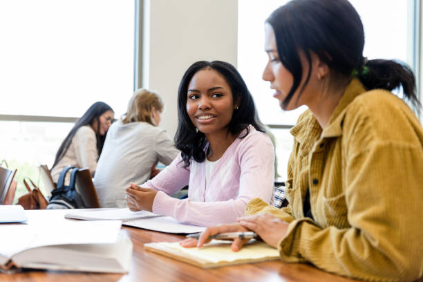 istock Two Diverse Female Students Studying Together in a Classroom 2203120215