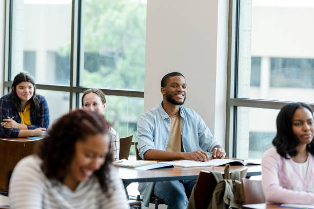 istock Diverse Students Attentively Listening in a Classroom 2203120255