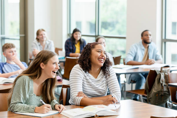 istock Happy Students Laughing Together in a Classroom 2203120257