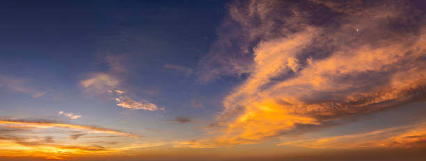 istock Getting dark at sundown. Sunset sky with scattered clouds of bright colors 2203125210