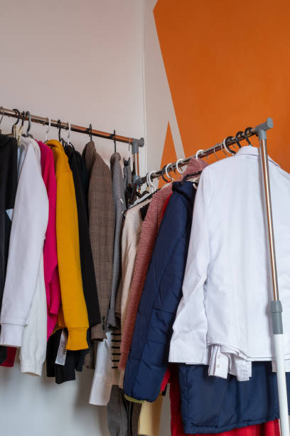 istock Clothing Rack with Various Jackets and Sweaters in a Room 2203125651