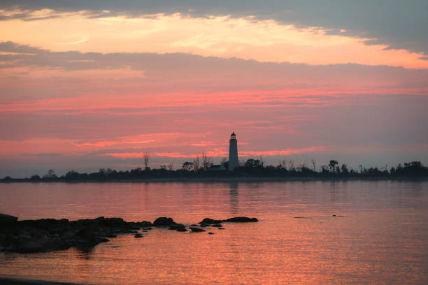istock Sunset and Lighthouse at the Lake 2203127322