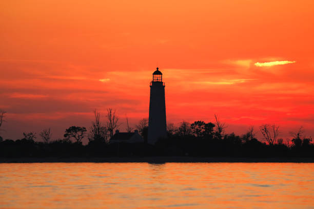 istock Sunset and Lighthouse at the Lake 2203128054