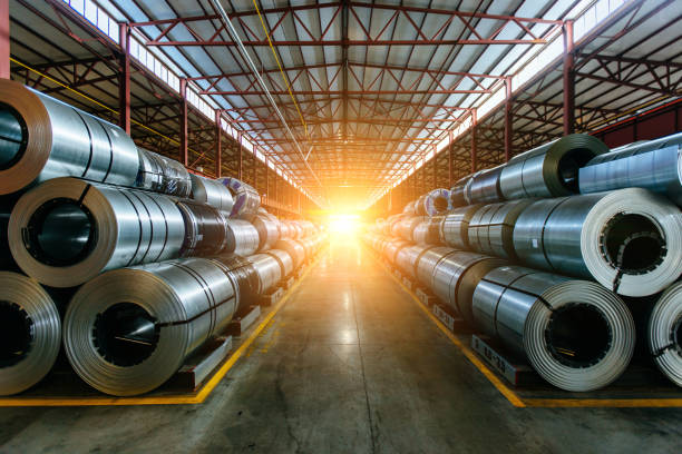 istock Galvanized steel sheet coils in metalworking factory 2203129409
