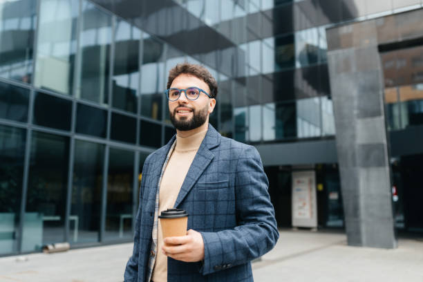 istock Confident Businessman with Coffee in the City 2203129475