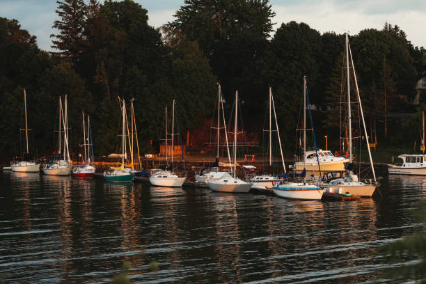 Sailboats docked at a small marina along Lake Huron.