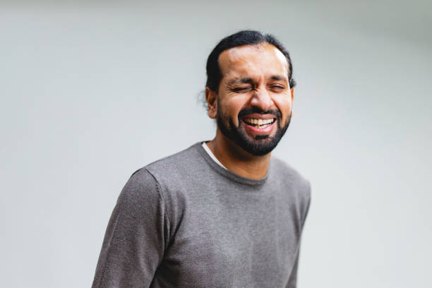 istock Portrait of Laughing Indian Man in Studio 2203129841