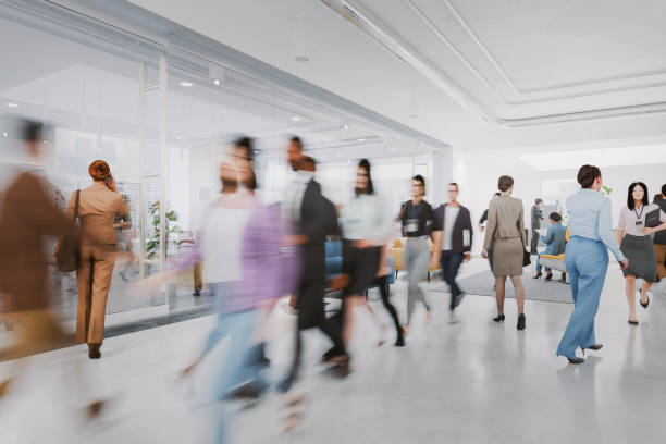 istock Busy office environment with people in motion 2203131124