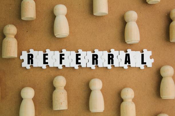 istock wooden figures with referral alphabet words. reference concept. recruiting strategy in which employers encourage current employees. 2203136488