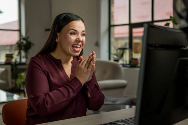 istock Excited Young Woman Working on Desktop in Home Office 2203140276