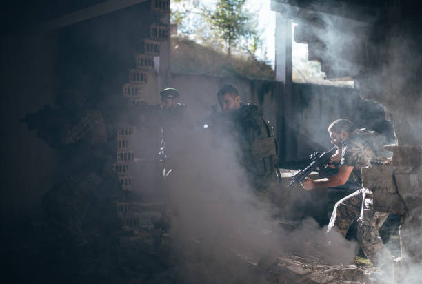 istock Group of soldiers escape the building from explosion. 2203140501