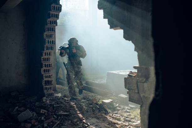 istock Group of soldiers escape the building from explosion. 2203140522