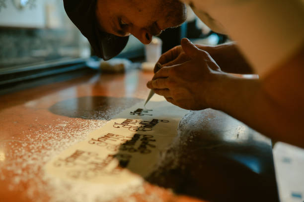 istock man decorating cakes in a patisserie 2203143211