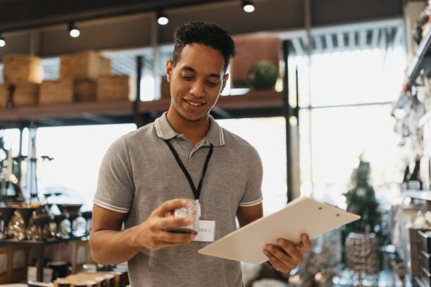 istock Happy Employee Checking Inventory in Store 2203143564
