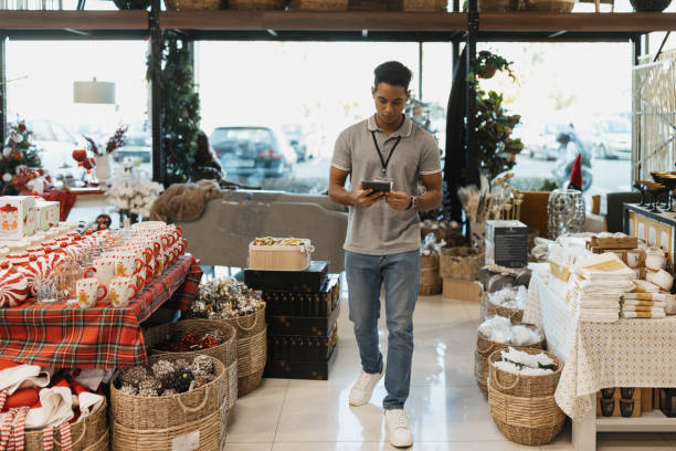 istock Retail Employee Walking with Inventory Checklist 2203143608