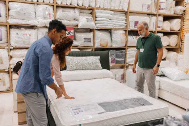 Couple testing a mattress for comfort and support