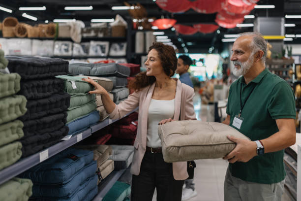 istock Deliberating on cushion choices with a friendly touch 2203145158