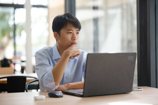 istock Business consultant analyzing financial data on a laptop 2203148235