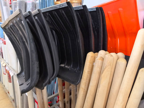 istock Multiple shovels and tools arranged neatly in a hardware store aisle 2203150257