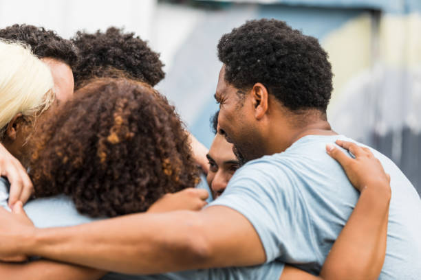 istock Multiracial Group of People Embracing in Support and Togetherness 2203150627
