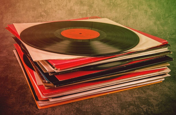Vinyl record on the table. Retro style toned image.