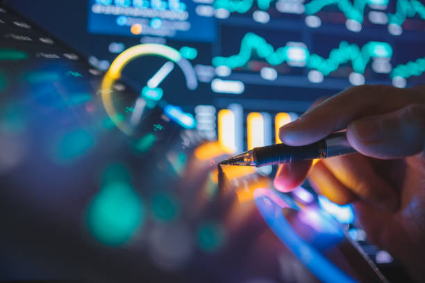 istock Businessmen consulting using digital tablet fintech and visual applied AI machine Learning next generation technology conceptual abstract to making sale in business 2203150750