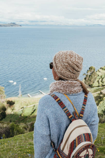 istock Traveler with Backpack Enjoying Scenic Coastal View 2203152290