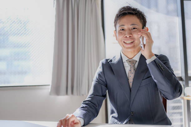 istock Phone and business man 2203152810