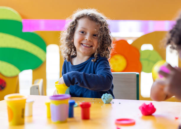 istock Happy preschool student smiling in the classroom 2203154717